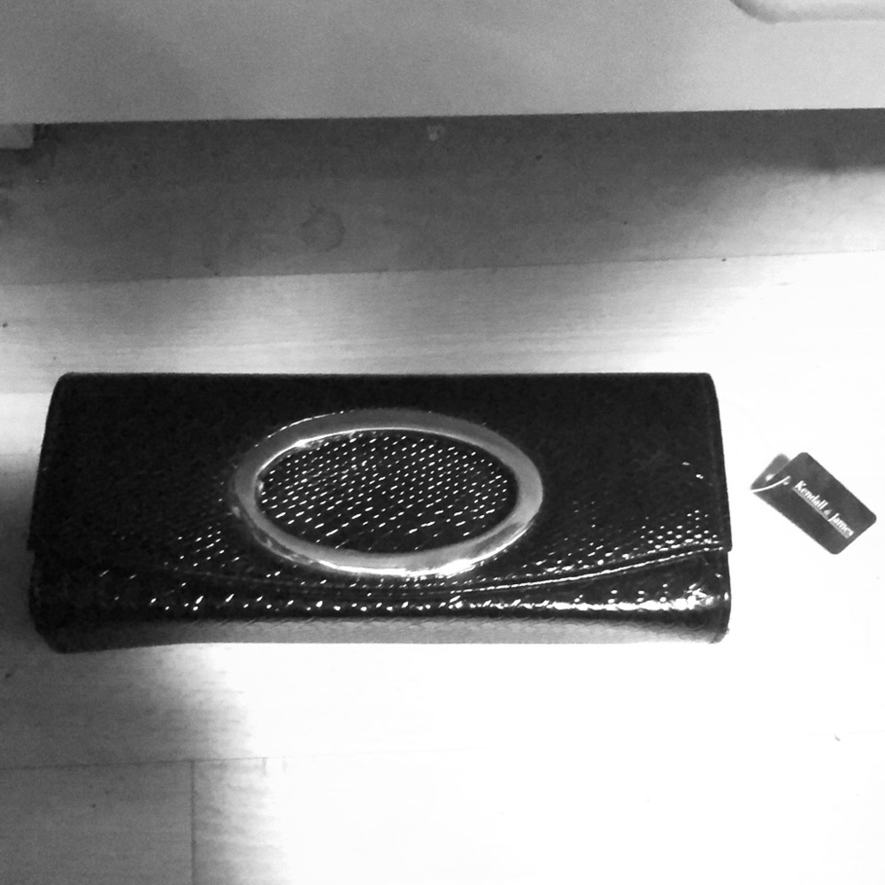 Snake print black clutch